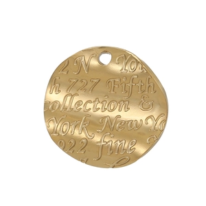Detail of round golden embossed heart pendant showing 922 fine and address engraving