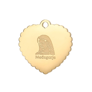 Detailed view of heart-shaped gold pendant featuring Virgin Mary engraving and wavy edges