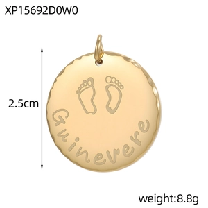 Detail of 25mm gold stainless steel round charm with baby footprint and Guinevere engraving