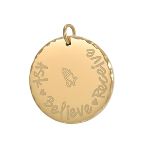 Close-up of golden geometric pendant with Ask Believe Receive engraving and praying hands