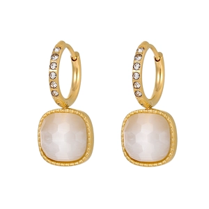 Detail of gold geometric hoop earrings with opal pendant and sparkling zircon accents