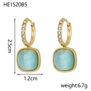 Detail view of gold hoop earrings with light blue square stone charms and dimensions