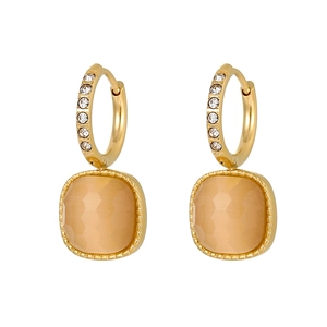 Detail view of golden square amber gemstone earrings with sparkling zircon inlay accents