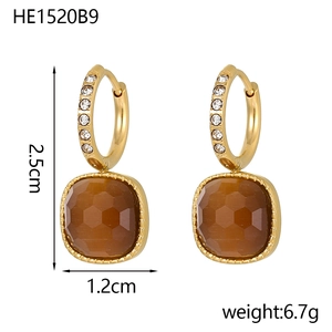 Detail view of gold earrings with square brown gemstones and dimensions 2.5cm by 1.2cm