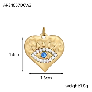 Pendentif cœur Mauvais Œil doré avec pierre bleue et zircons, dimensions 1,4cm x 1,5cm