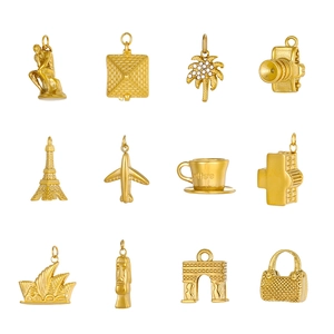 12-piece gold vintage charms set featuring landmarks like Eiffel Tower and Pyramid icons