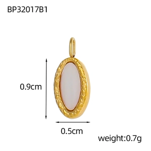 Macro shot of oval shell pendant with gold frame measuring zero point nine centimeters