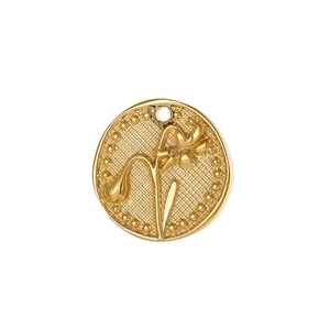 Golden round pendant necklace with flower embossing and vintage beaded edge on white background
