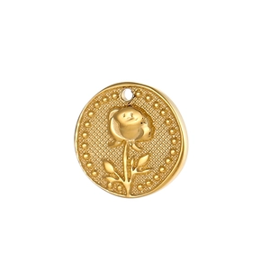 Macro shot of gold embossed rose flower pendant in vintage stainless steel style