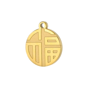 Detailed view of a gold round Fu pendant with geometric Chinese character engraving