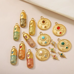 Gold-plated charms set featuring capsule, sun disk and star shapes with colorful gemstones