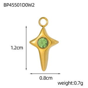 Detail view of a 1.2cm gold star pendant with center green crystal and size dimensions
