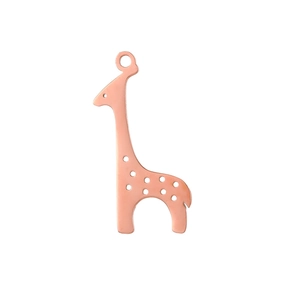 Macro detail of giraffe animal pendant in rose gold finish with cutout spot patterns