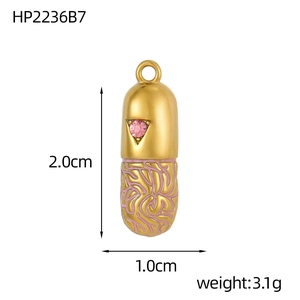 Detailed size view of a gold capsule pendant with pink enamel and star gemstone detail
