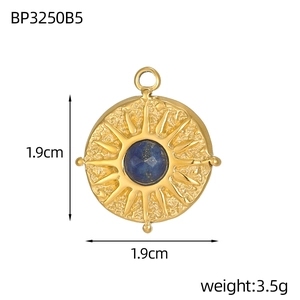 Detail of a 1.9cm sunburst tarot pendant with blue zircon inlay and 3.5g weight
