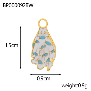 Detail view of a small ghost ghost charm with size markings of 1.5cm by 0.9cm height