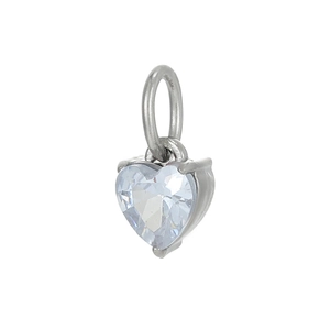 Macro shot of silver heart pendant with sparkling clear zircon stone and polished finish