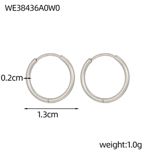 Detail view of 1.3cm silver geometric hoop earrings showing 0.2cm thickness and dimensions