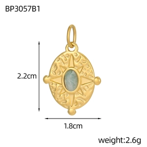 Golden starburst compass pendant with turquoise inlay measuring 2.2cm in height