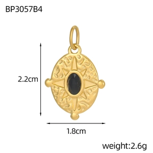 Macro view of gold vintage oval pendant with black stone and precise size measurements