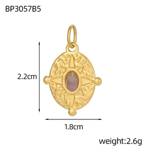 Detailed view of oval gold pendant with purple stone, measuring 2.2cm in height