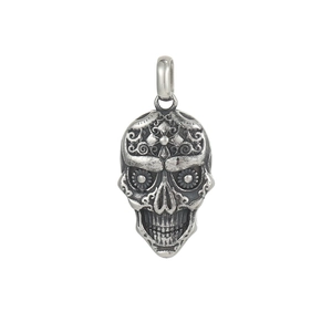 Gothic stainless steel Day of the Dead skull pendant with floral engraving on white background