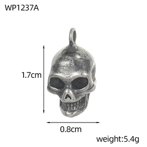 Detail of vintage skull pendant showing dimensions 1.7cm by 0.8cm and 5.4g weight