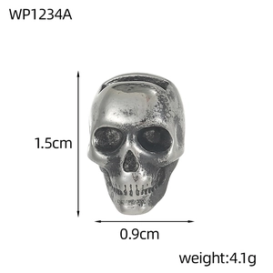 Macro view of vintage stainless steel skull pendant with gothic textures and dimensions