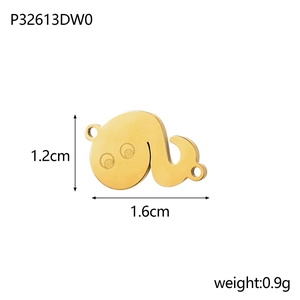 Macro shot of gold whale pendant with dimensions 1.2cm height and 1.6cm width