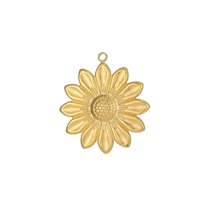 Detail view of golden stainless steel sunflower pendant with textured core and petals