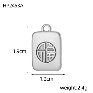 Detail view of square silver pendant featuring traditional Chinese Fu character engraving