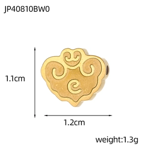 Macro view of golden cloud relief bead with size dimensions and hole for DIY jewelry