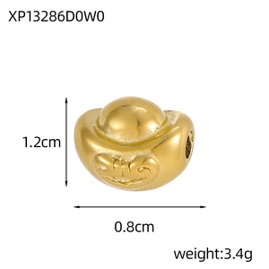 Macro detail of a 1.2cm gold ingot pendant with embossed patterns and side hole