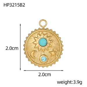 Detailed view of a golden stainless steel sun and moon pendant with turquoise stone