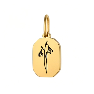 Detailopname van de gouden achthoekige bloemenhanger met minimalistische gravure