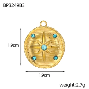 Detailed view of vintage starburst pendant with blue zircon stones and size measurements