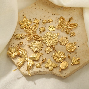 Golden stainless steel nature pendants with butterfly and flower charms for DIY jewelry