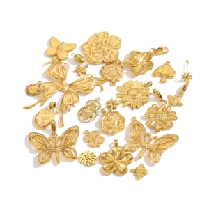 Various gold plated stainless steel pendants with butterfly and bee floral designs
