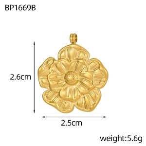 Detailed view of a gold flower pendant with embossed texture and size measurements