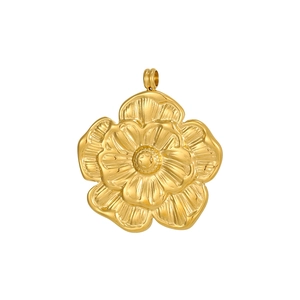 Macro shot of gold floral pendant with embossed texture and polished petal details