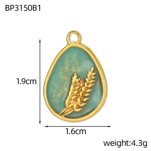 Detailed view of water drop pendant showing green glaze and golden wheat ear pattern