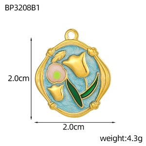 Detailed view of a gold 2.0cm tulip flower pendant with blue enamel and 4.3g weight