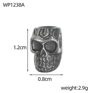 Detailed view of vintage silver skull charm with 1.2cm x 0.8cm size and 2.9g weight specs