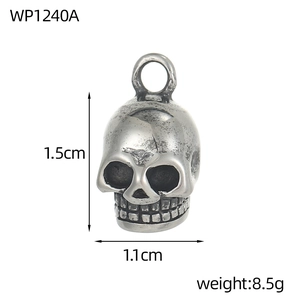 Detail view of gothic stainless steel skull pendant with size marks 1.5cm by 1.1cm