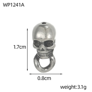 Macro detail of gothic skull charm pendant showing 1.7cm height and 0.8cm width dimensions