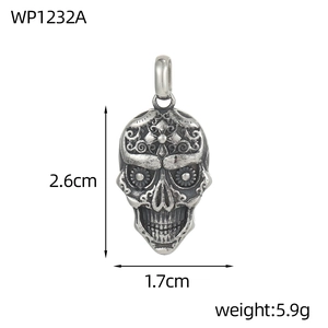 Macro shot of vintage skull pendant with intricate floral engravings and antique finish