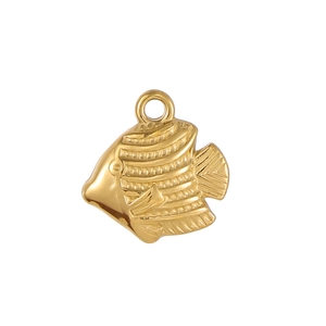 Macro detail of golden stainless steel tropical fish pendant with textured scales