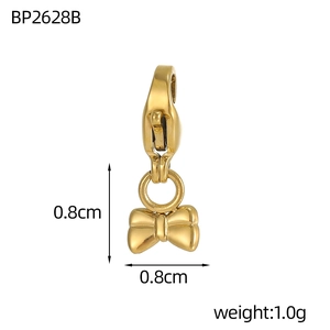 Macro shot of 18k gold plated bow pendant with lobster clasp and dimensional glossy finish