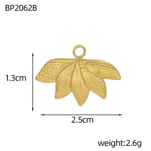 Detailed view of a golden leaf pendant showing 2.5cm width and mesh texture finish