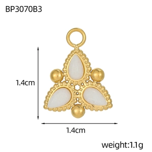 Macro detail of a 1.4cm gold-plated triangle pendant with inlaid white teardrop stones